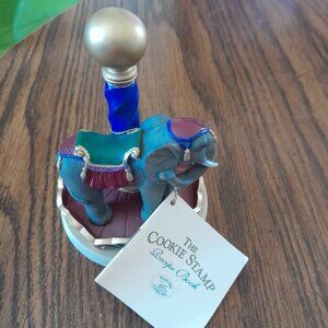 Carousel animal elephant cookie stamp with cookie recipe.